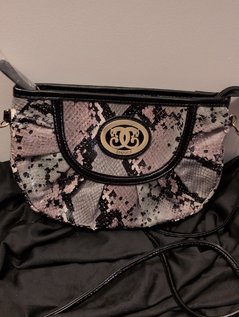 Sharif Pink and Black Snake-Print Crossbody with Gold Emblem